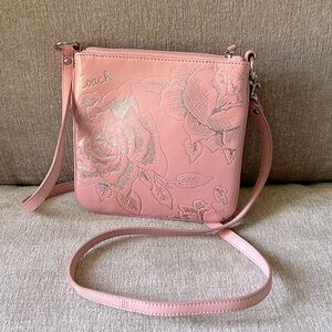 COACH pink leather crossbody bag with embossed floral design